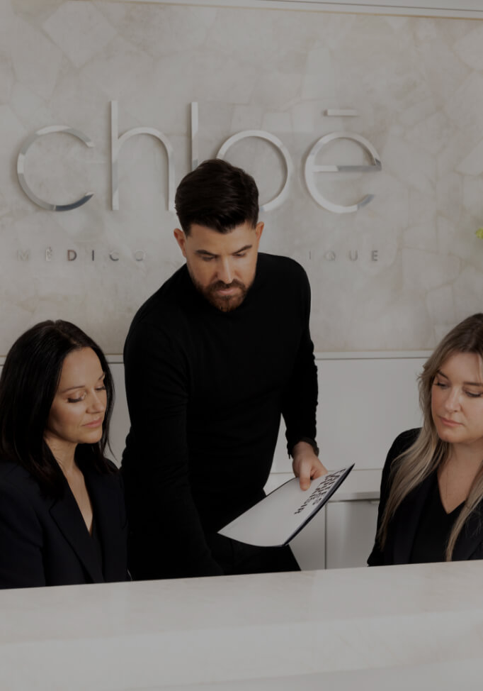 Maxime Surprenant, director of Clinique Chloé, using a smart tablet screen in the waiting room