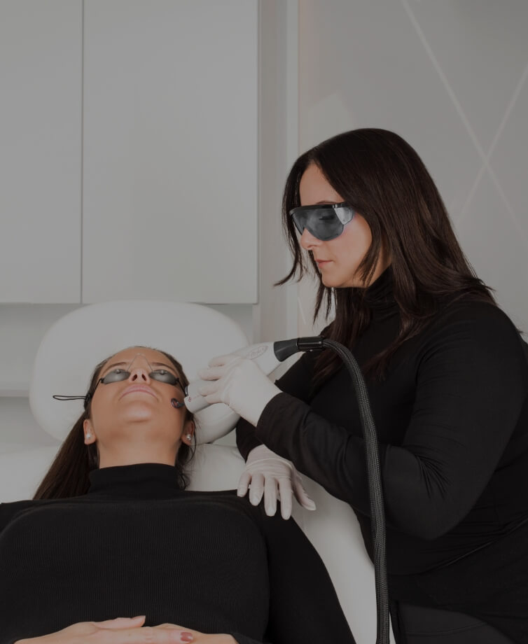 Lynn Ferrazzano, laser technician at Clinique Chloé, doing a laser treatment on a patient. 